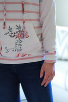 Sleeve detailing on floral sweatshirt.